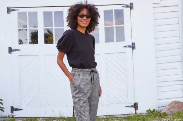 A model wearing the ankle pants in plaid