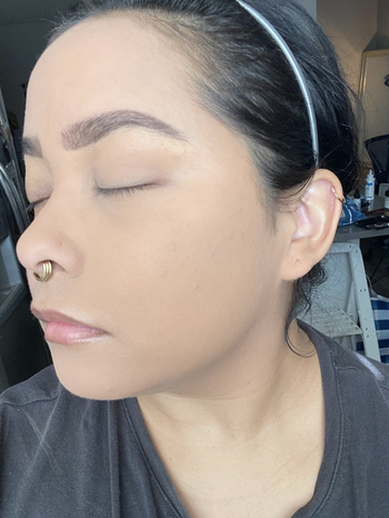 reviewer showing skin with foundation 