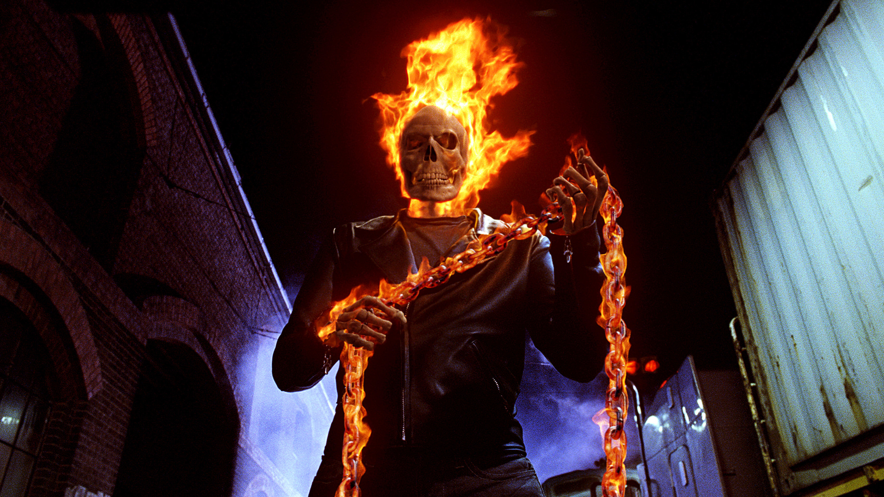 Ghost Rider holding a chain that is on fire