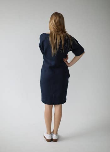 Back view of a model wearing the dress