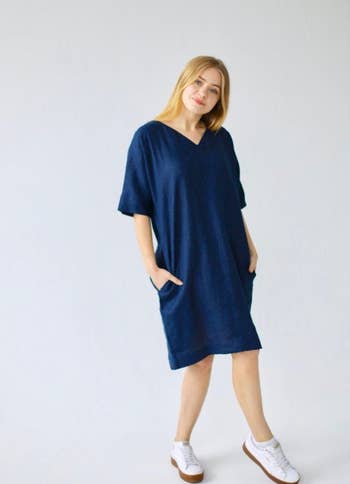 front view of a model wearing the dress in blue
