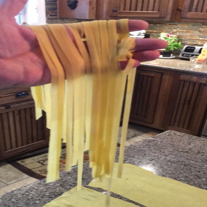 a reviewer holding their fresh pasta