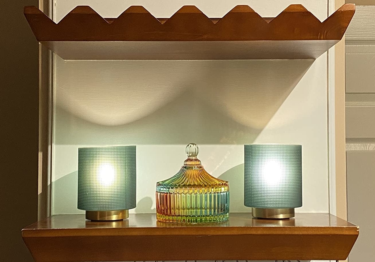 reviewer image of the rainbow crystal tent-shaped dish with a lid on a shelf