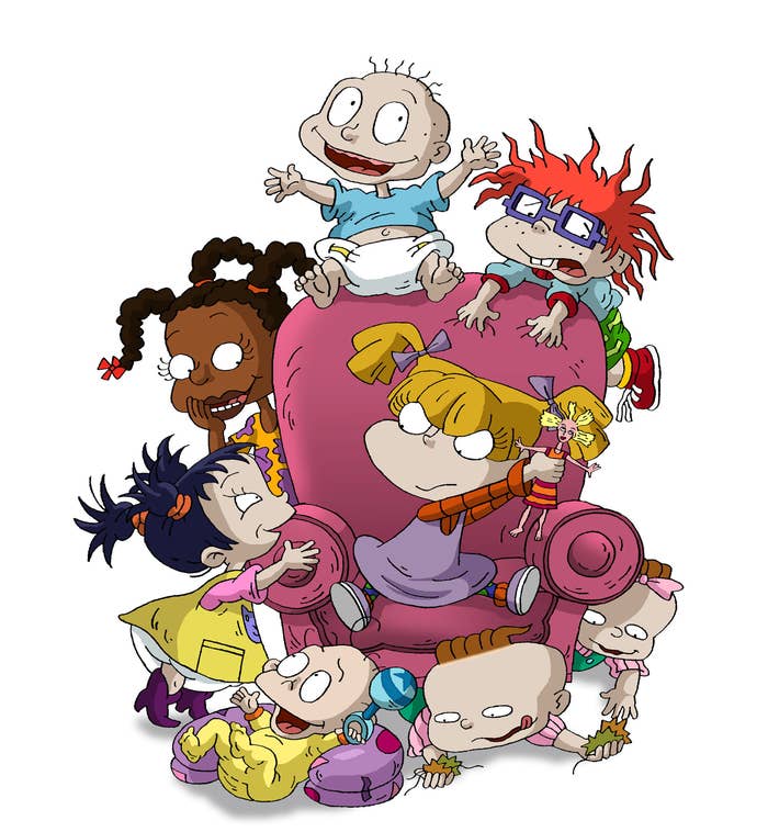 The Rugrats playing on a couch as Angelica  tries to keep her doll safe