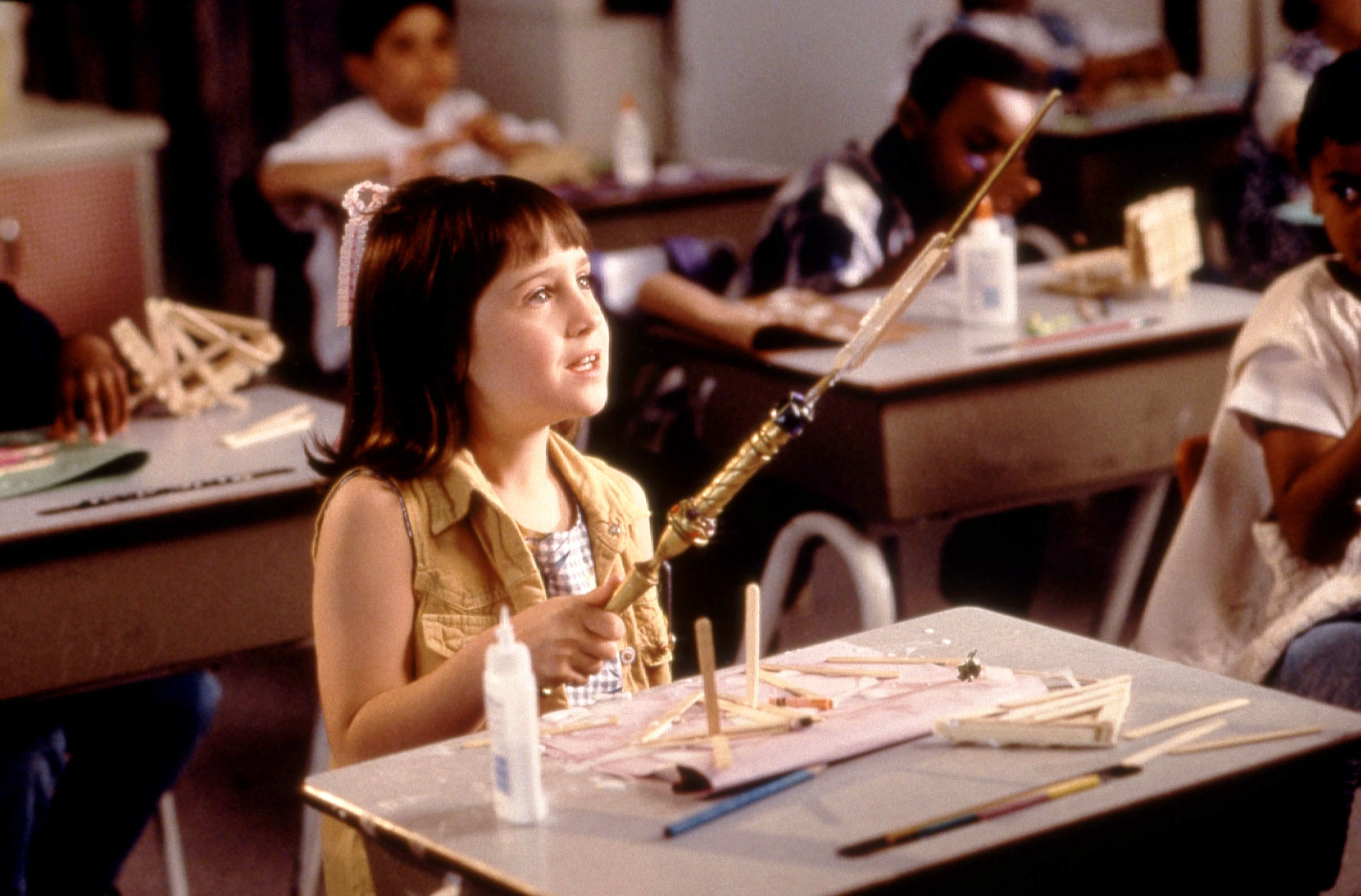 Mara Wilson sitting at a desk in A Simple Wish