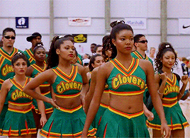 Isis entering the cheer arena with the clovers