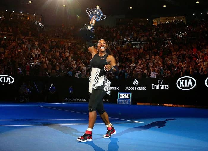 Serena Williams holding a trophy 