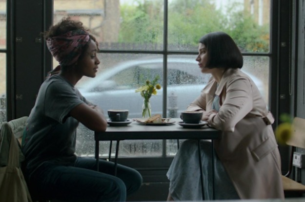 Louise and Adele sit at a cafe table in Behind Her Eyes