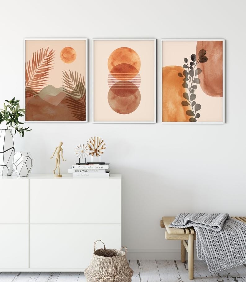 Three prints together as a series showing plant leaves and abstract shapes 