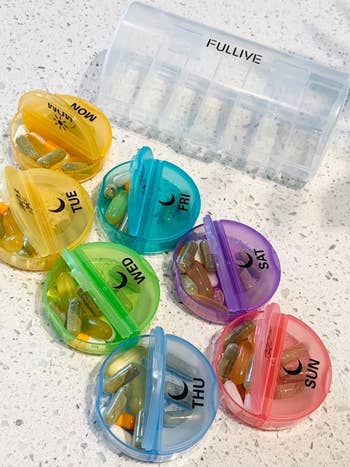 The days of the week containers with pills inside each of them
