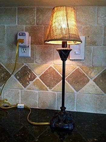 a lamp plugged into the outlet
