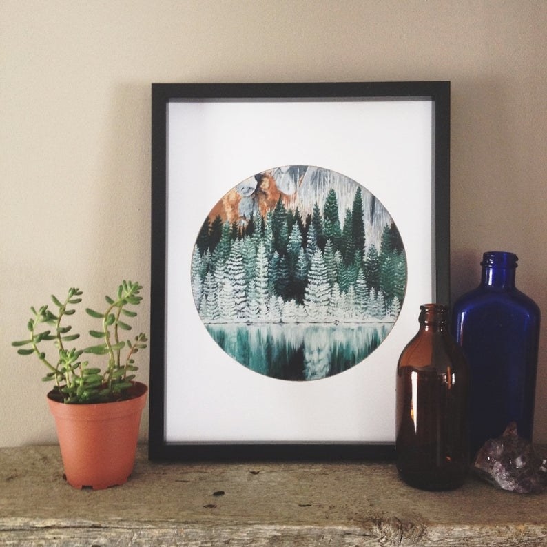 A forest scene painted within a circle 