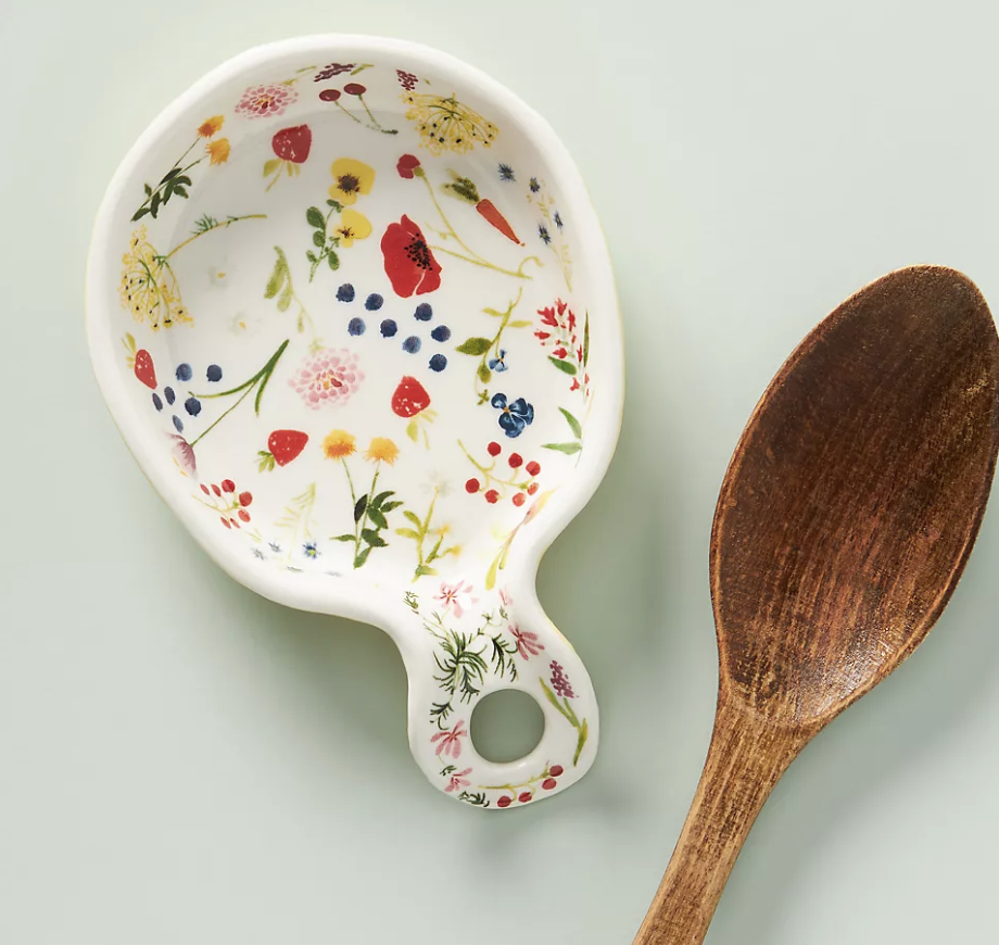 White spoon rest with colorful floral design 