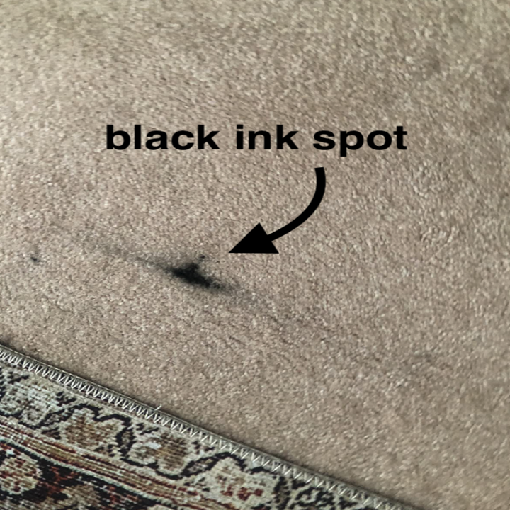 reviewer image of carpet with black ink spot