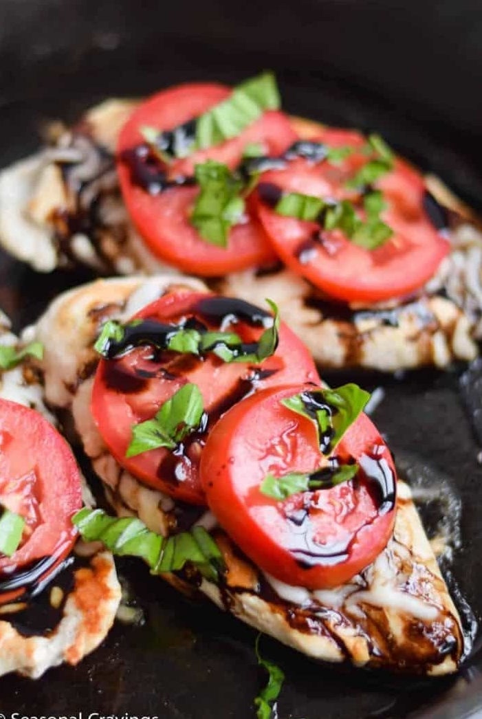 Three pieces of grilled Caprese chicken.