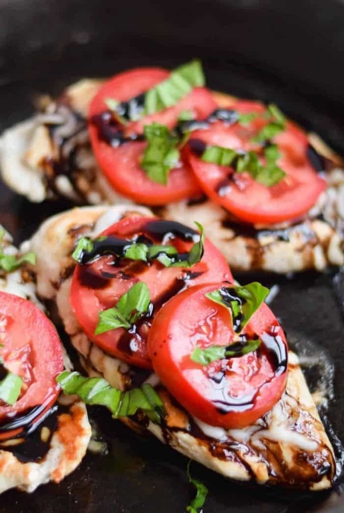 Three pieces of grilled Caprese chicken.