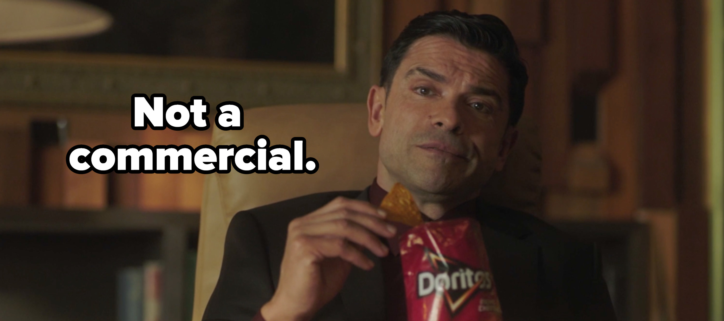 Hiram eating doritos with the caption &quot;not a commercial&quot; 