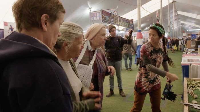 Chloé Zhao directs members of the cast at an RV show