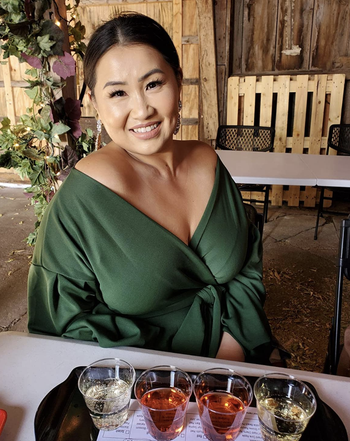 reviewer wearing the green top