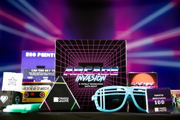 an arcade invasion themed date night box