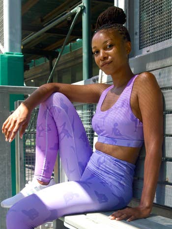 model wears light purple leggings with silhouettes of women working out