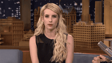 Emma Roberts looks directly into the camera and narrows her eyes on The Tonight Show Starring Jimmy Fallon
