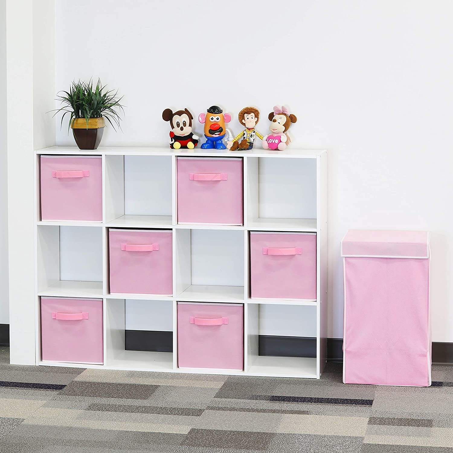 A large bookshelf with cube-shaped compartments, half the cubes have a large fabric storage box on them