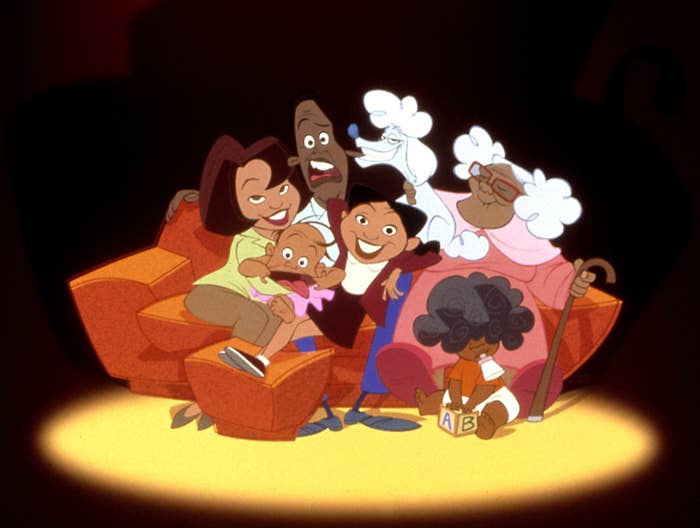 The Proud family and their dog on the couch