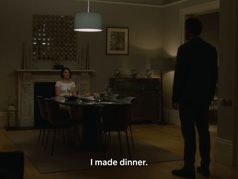Adele sits at a dining table and says &quot;I made dinner&quot; as David stands in the doorway