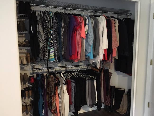 reviewer pic of the system in their closet with all their clothes and shoes organized