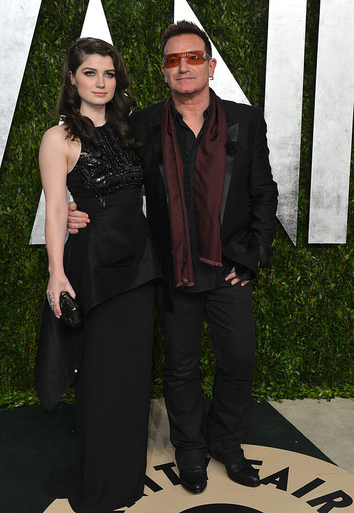 Eve and Bono posing for photographs at an event