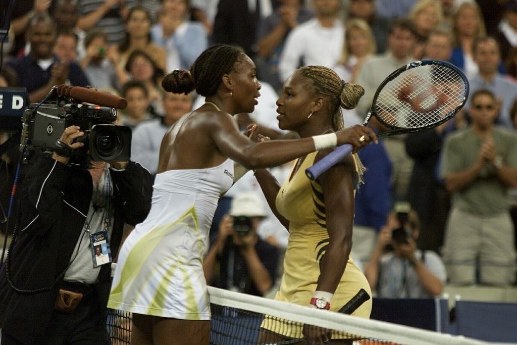 Venus and Serena Williams hug after Venus won the US Open September 8, 2001 