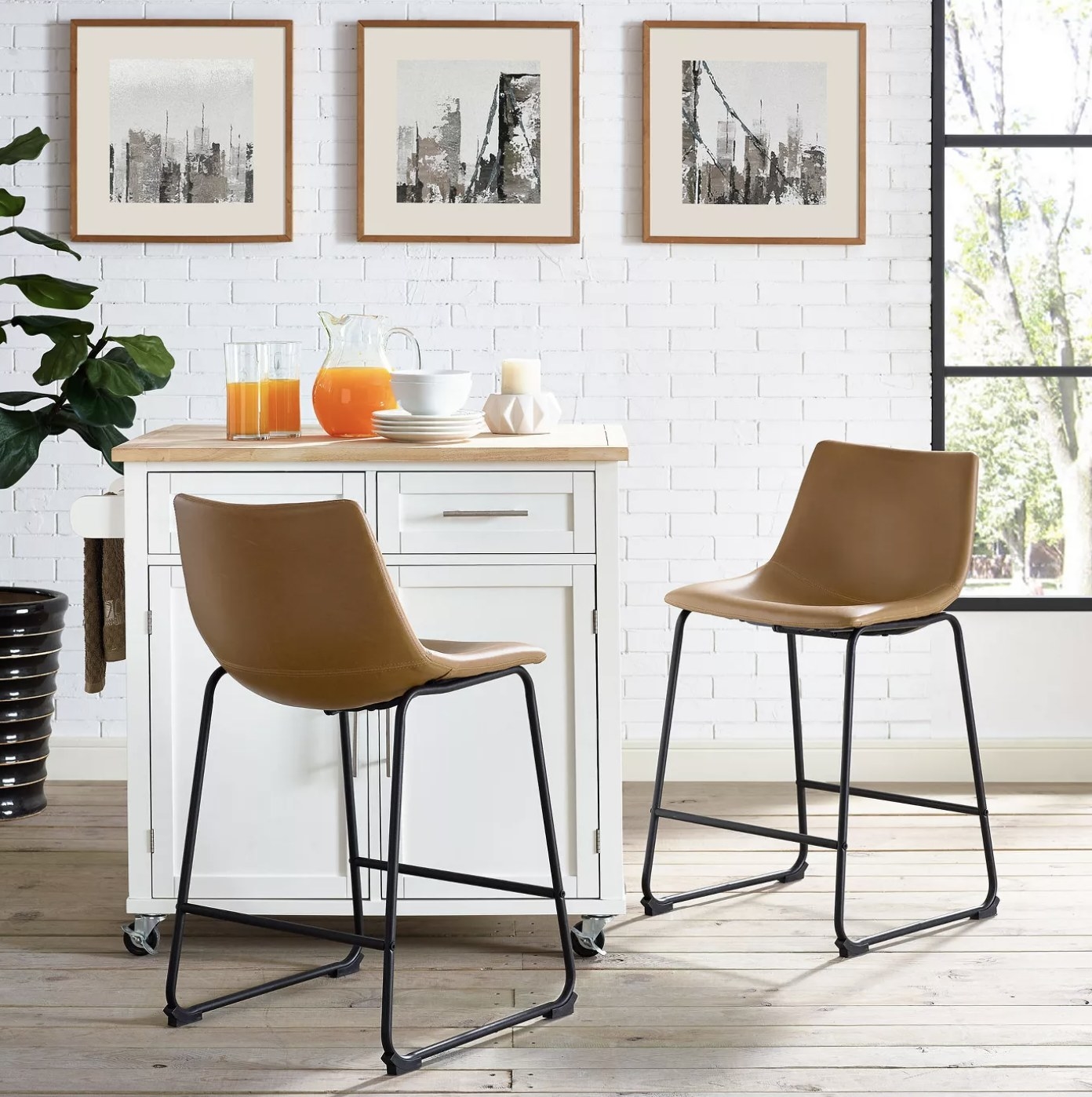 Two brown faux leather barstools