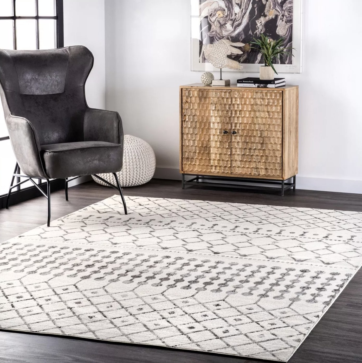 The white rug with dark grey designs