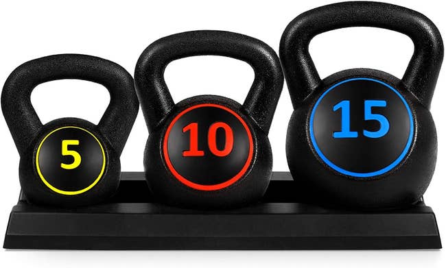 three kettle bells with different colors to indicate different weights on each