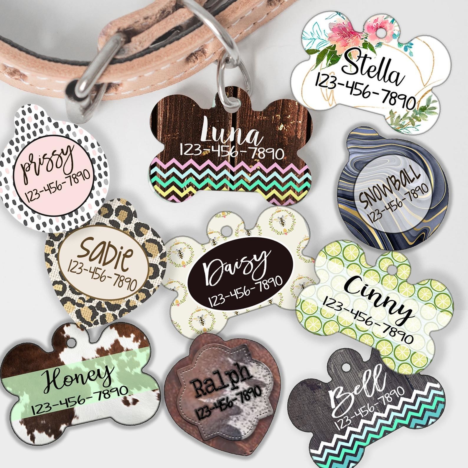 Ten dog tags in various shapes and patterns