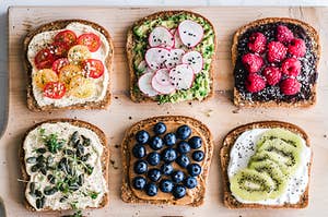 A platter of toast with different colorful toppings 