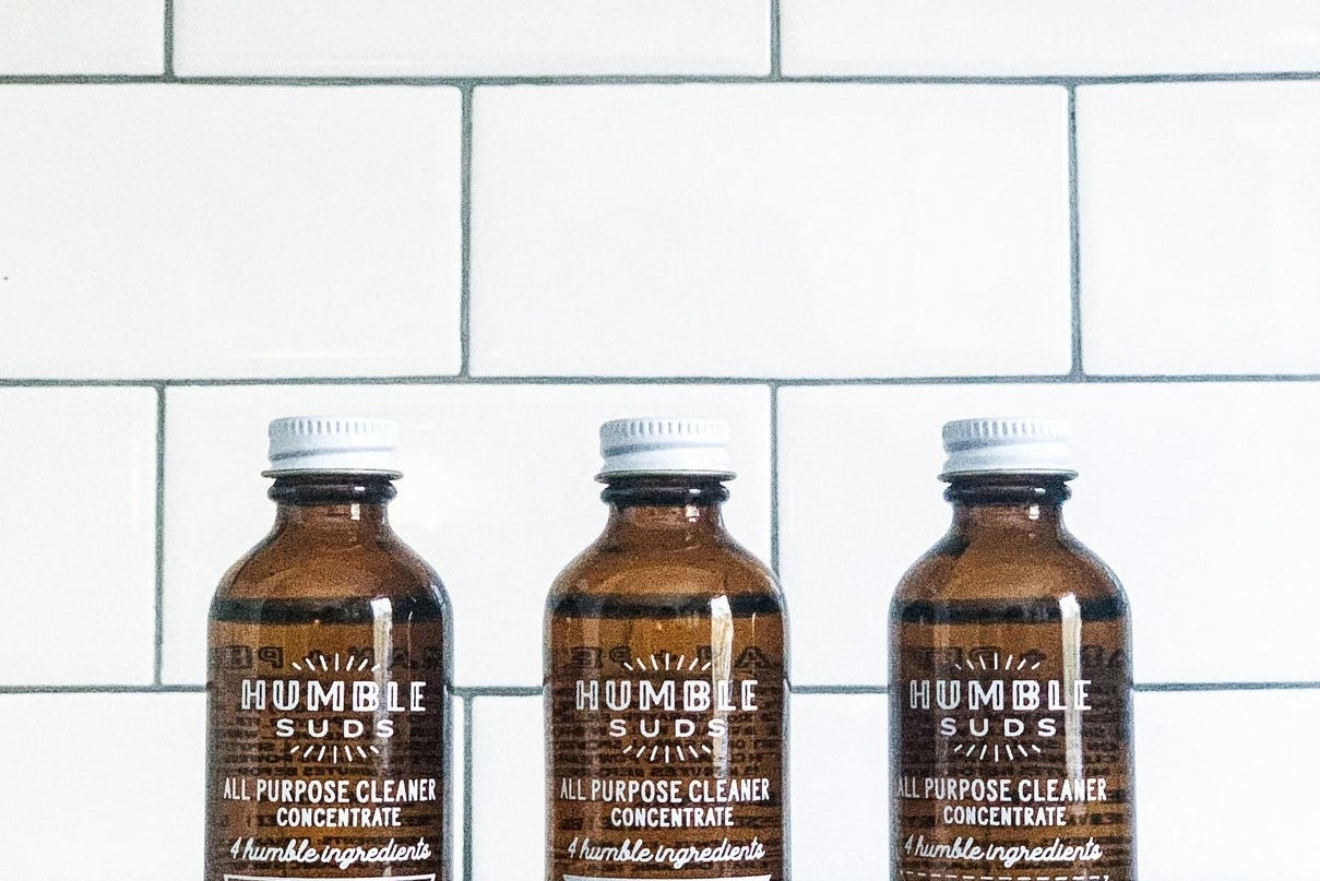 three bottles of the all-purpose cleaner in different scents