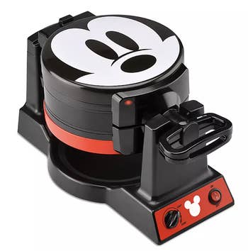 a waffle maker with mickey's face on it