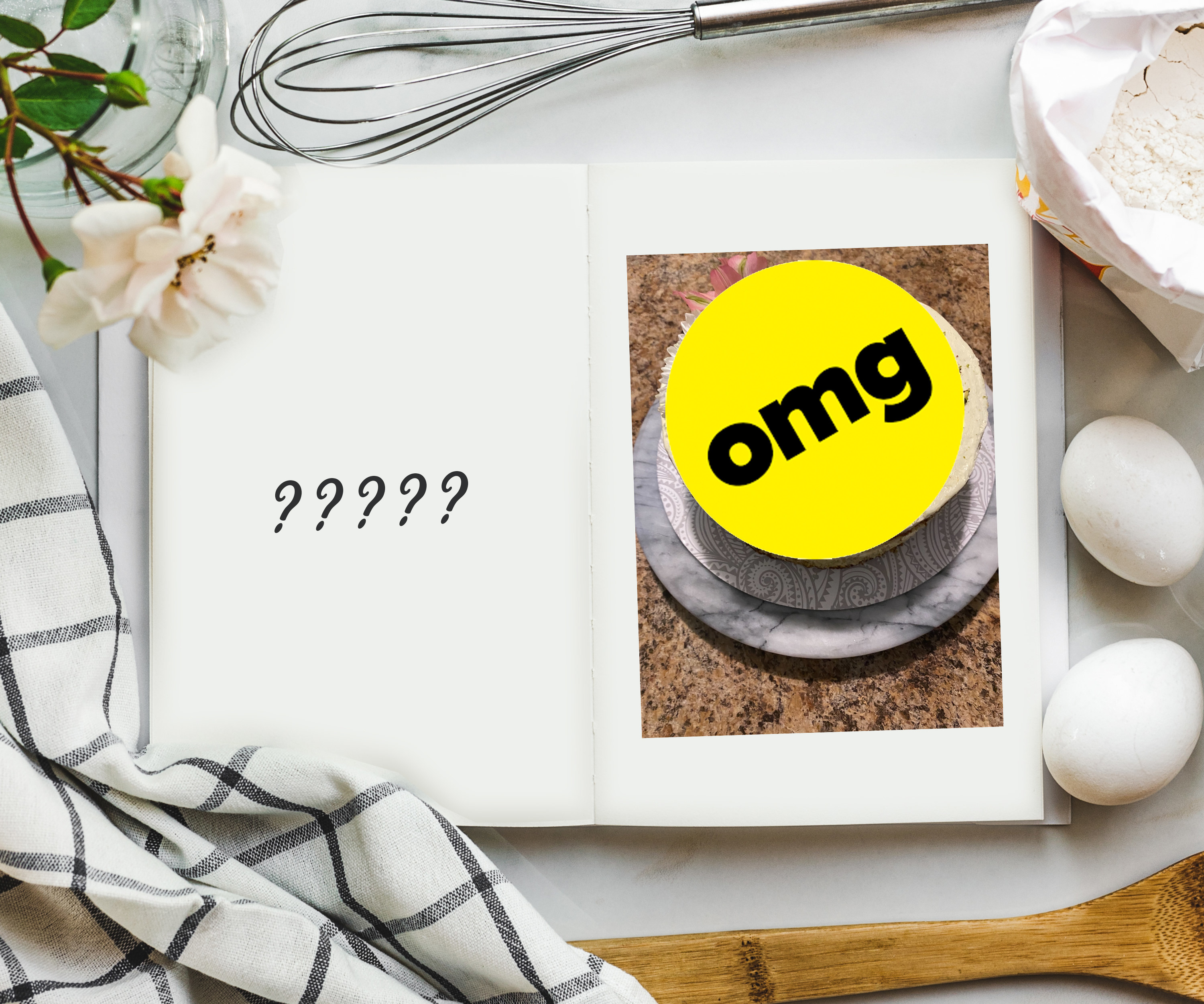 An overhead shot of cookbook on a table surrounded by ingredients and a photo on the inside that is covered with a sticker that says OMG.