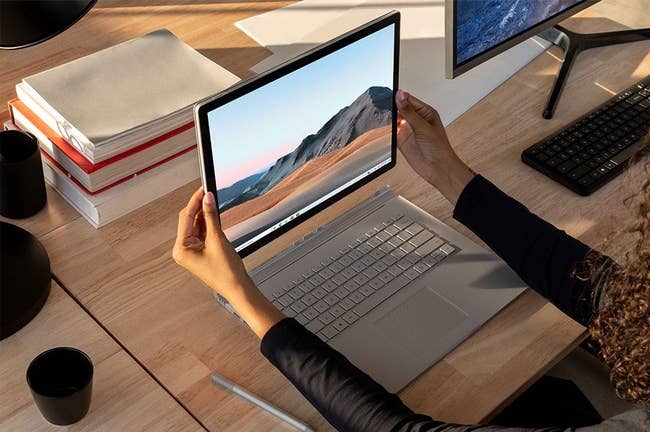 the silver surface book laptop with the screen detached