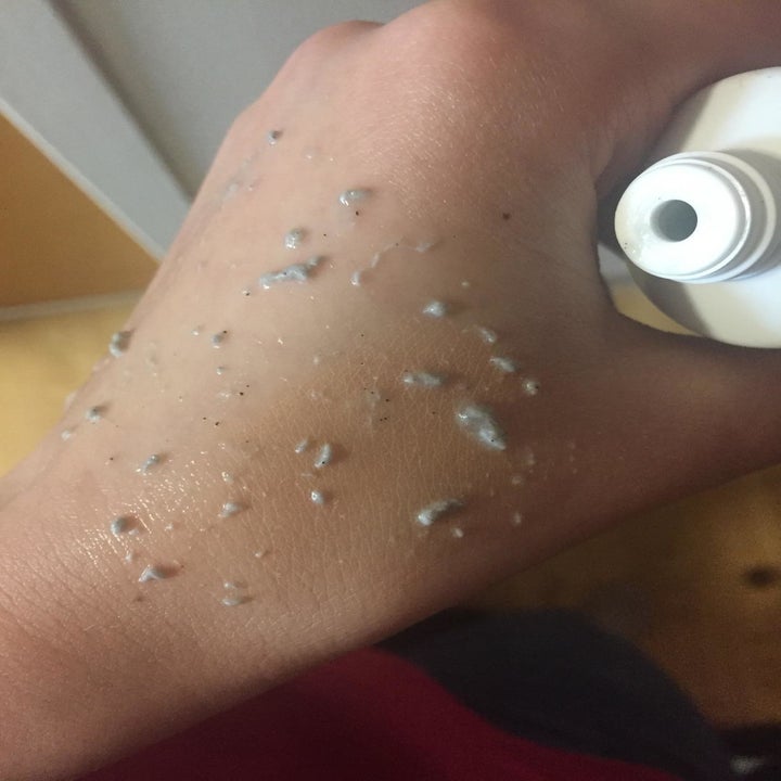 The reviewer showing the grey scrub texture on their hand