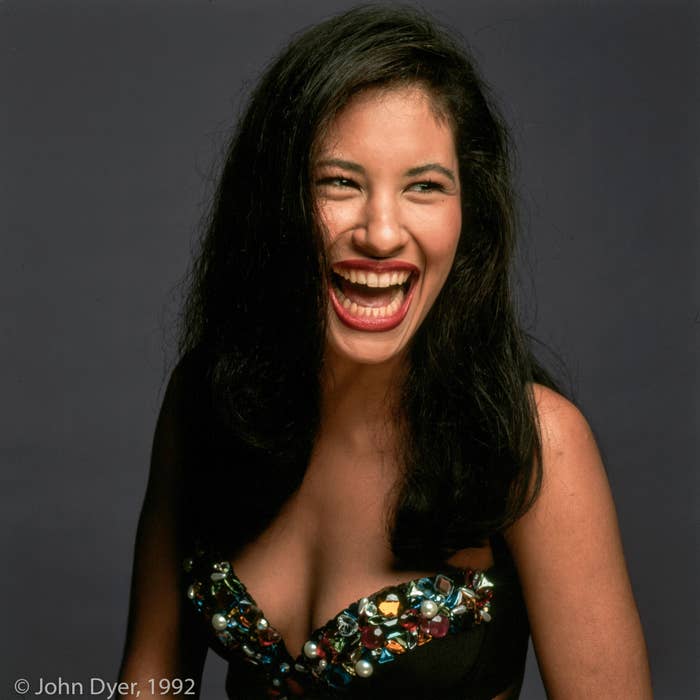 selena quintanilla laughing while having her photograph taken 