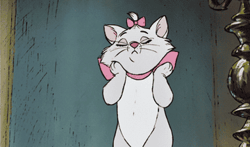a gif of marie from the aristocats fluffing her cheeks