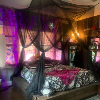 Different reviewer with a dark, goth room, with the black canopy draped over the bed