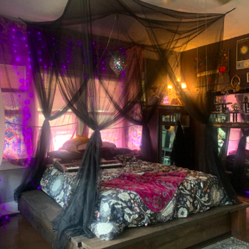 Different reviewer with a dark, goth room, with the black canopy draped over the bed