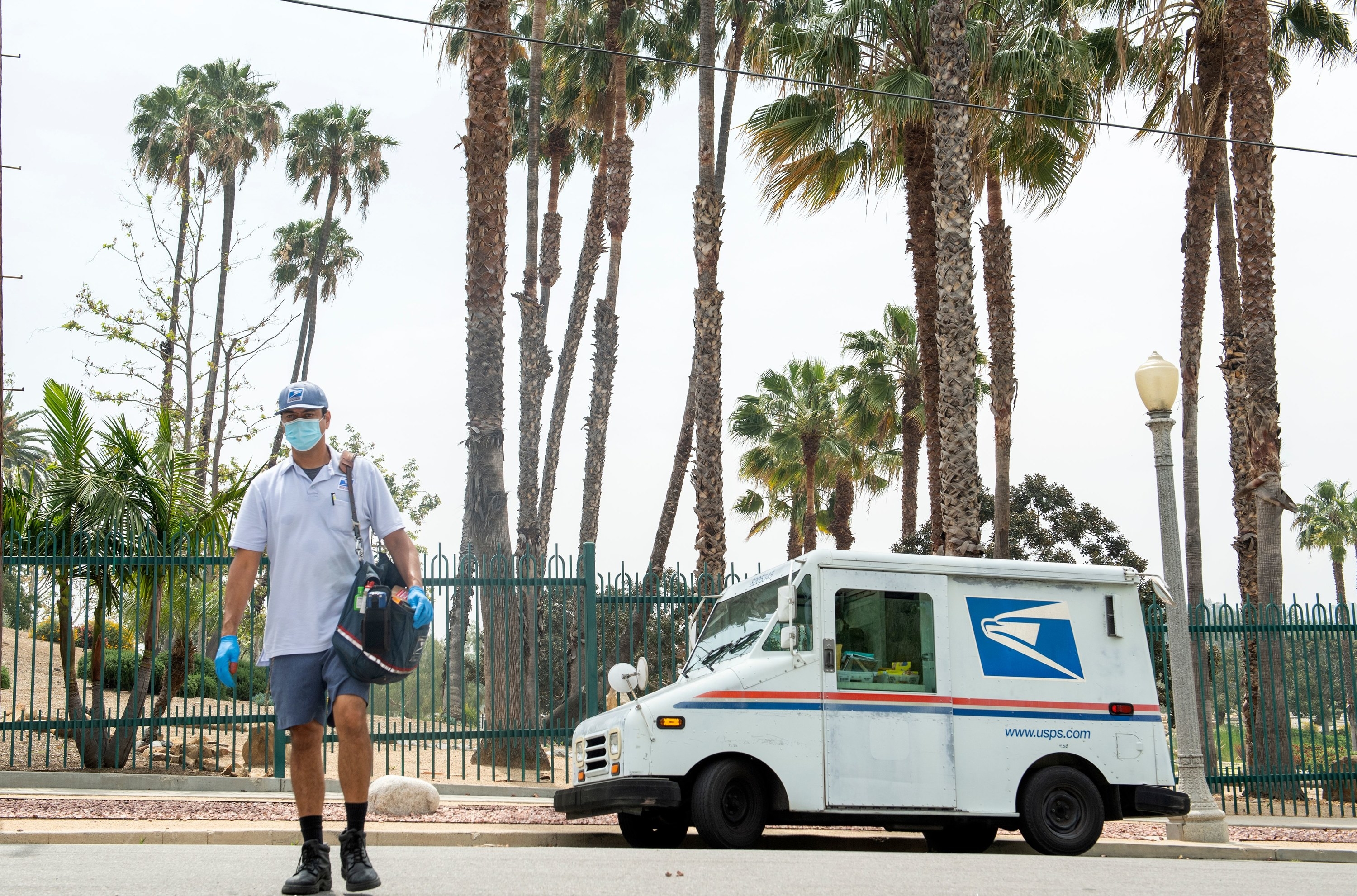 A postal worker and an old truck