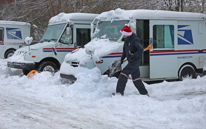  A mail truck covered in snow