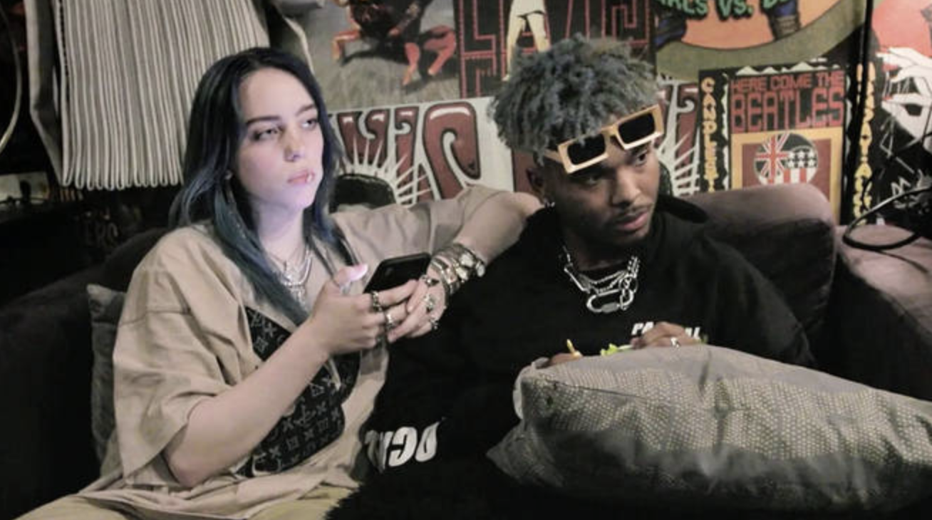 Billie and Q sitting on a couch
