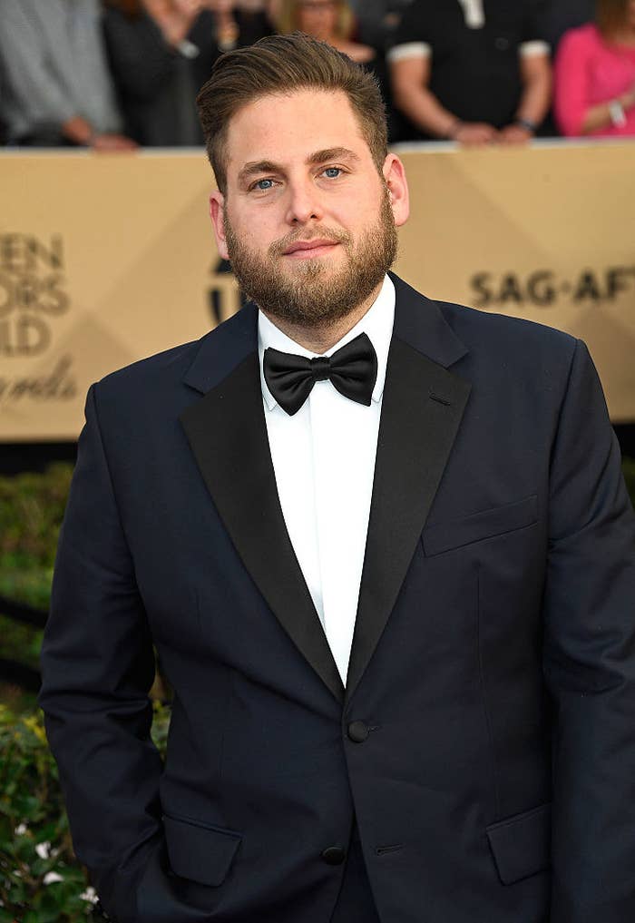 Jonah posing on the red carpet in a tux